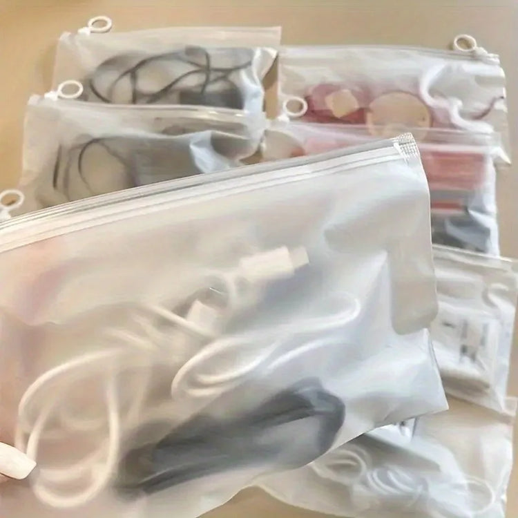 Sacs de rangement transparents avec anneau de traction 23×14 cm, multifonctionnels et étanches, pochettes zippées pour bijoux, cosmétiques, câbles, papeterie et petits articles, réutilisables et portables. Livraison offerte !