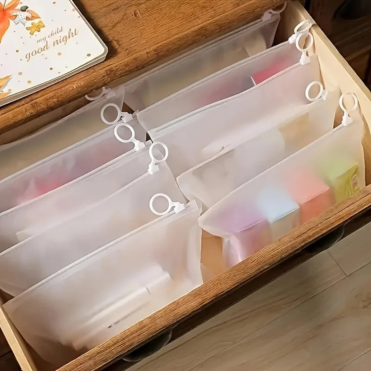 Sacs de rangement transparents avec anneau de traction 23×14 cm, multifonctionnels et étanches, pochettes zippées pour bijoux, cosmétiques, câbles, papeterie et petits articles, réutilisables et portables. Livraison offerte !