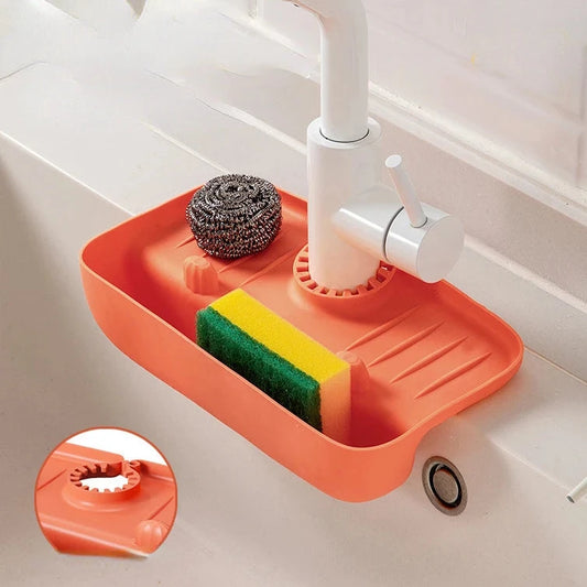 Égouttoir ajustable en silicone pour éponges, savons et brosses, parfait pour cuisines et salles de bain, avec design élégant et hygiénique pour un espace organisé et propre. La livraison prioritaire est offerte !