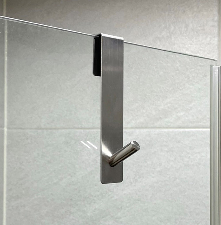 Crochet en acier inoxydable pour porte de douche en verre, installation sans perçage, design moderne antirayures, idéal pour suspendre serviettes, peignoirs et accessoires de salle de bain. Livraison offerte !