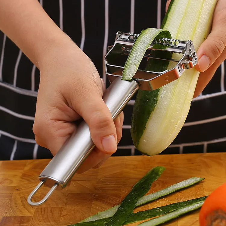 Éplucheur multifonctionnel en acier inoxydable avec double lame tranchante, ergonomique et facile à nettoyer, idéal pour fruits et légumes. La livraison est offerte !